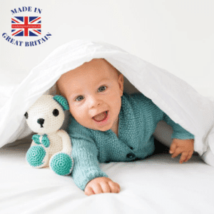 best british baby brands, best uk blog, cute baby hiding under a cover with a teddy bear, made in britain, british clothing brands, british business directory, best british feature, british blog
