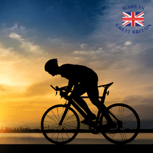 silhouette of a man riding a bicycle against a sun rise or set background, british bicycles and equipment, cycling clothing made in uk, british clothing brands, cycling clothing ,