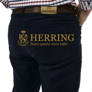 herring moleskin jeans worn by a man showing from behing with label and checked shirt, british made moleskin jeans