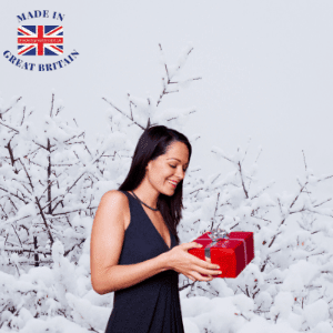 woman recieved a red box christmas gift in snowy backgrown, british made christmas presents, christmas gifts uk, buy a christmas gift uk, christmas gift shop uk,