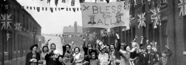 women and children celebrating ve day in 1945 on a street